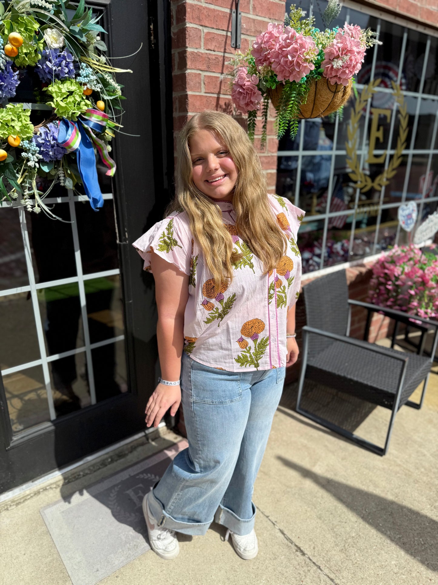 Fem De La Fleur Top in floral print, available in sizes XS–L, features a relaxed fit and lightweight fabric.