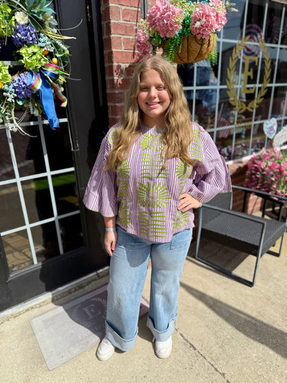 Purple Elena Blouse shown; available in XS-XL. Features long sleeves, v-neck, and relaxed fit.