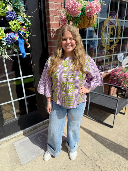 Purple Elena Blouse shown; available in XS-XL. Features long sleeves, v-neck, and relaxed fit.