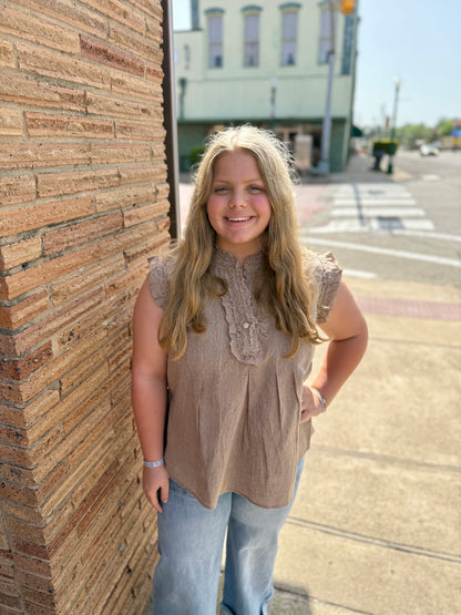 Striped Ruffle Top, available in XS-XL. Features ruffle details and bold stripes. Blue jeans not included.
