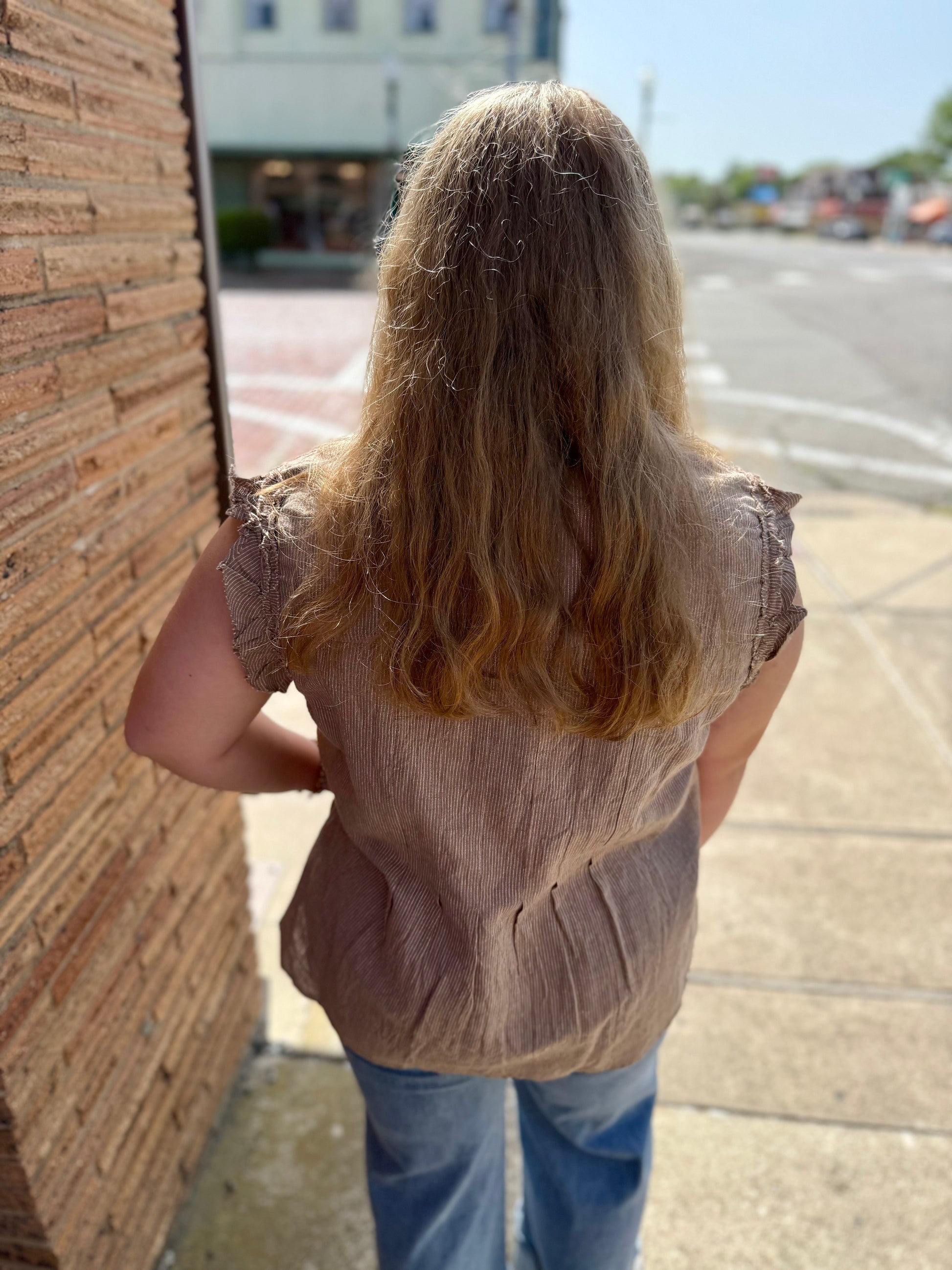 Striped Ruffle Top with ruffled sleeves and a relaxed fit. Available in sizes XS-XL.