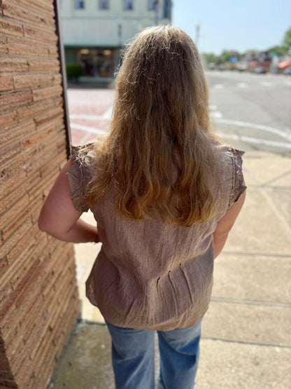 Striped Ruffle Top with ruffled sleeves and a relaxed fit. Available in sizes XS-XL.