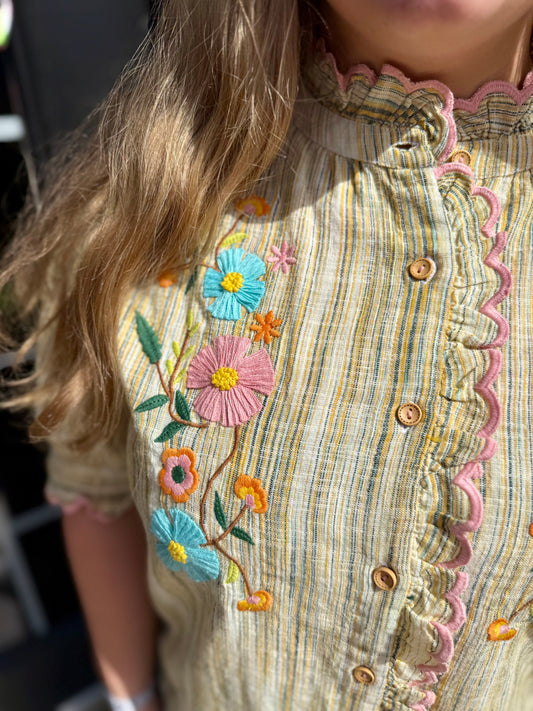 Striped, breathable cotton blouse with ruffled trim, floral embroidery, wooden buttons, pink scalloped edges. Sizes XS-XL.