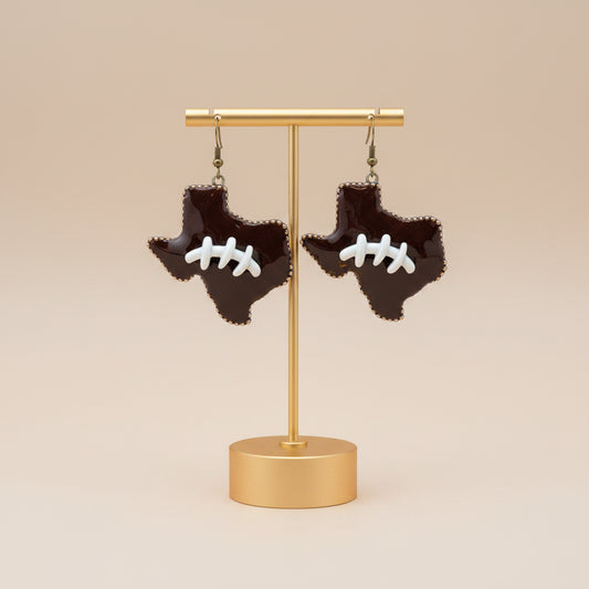 Texas Shaped Football Earrings with brown design and white football laces. Available sizes: small, medium, large.
