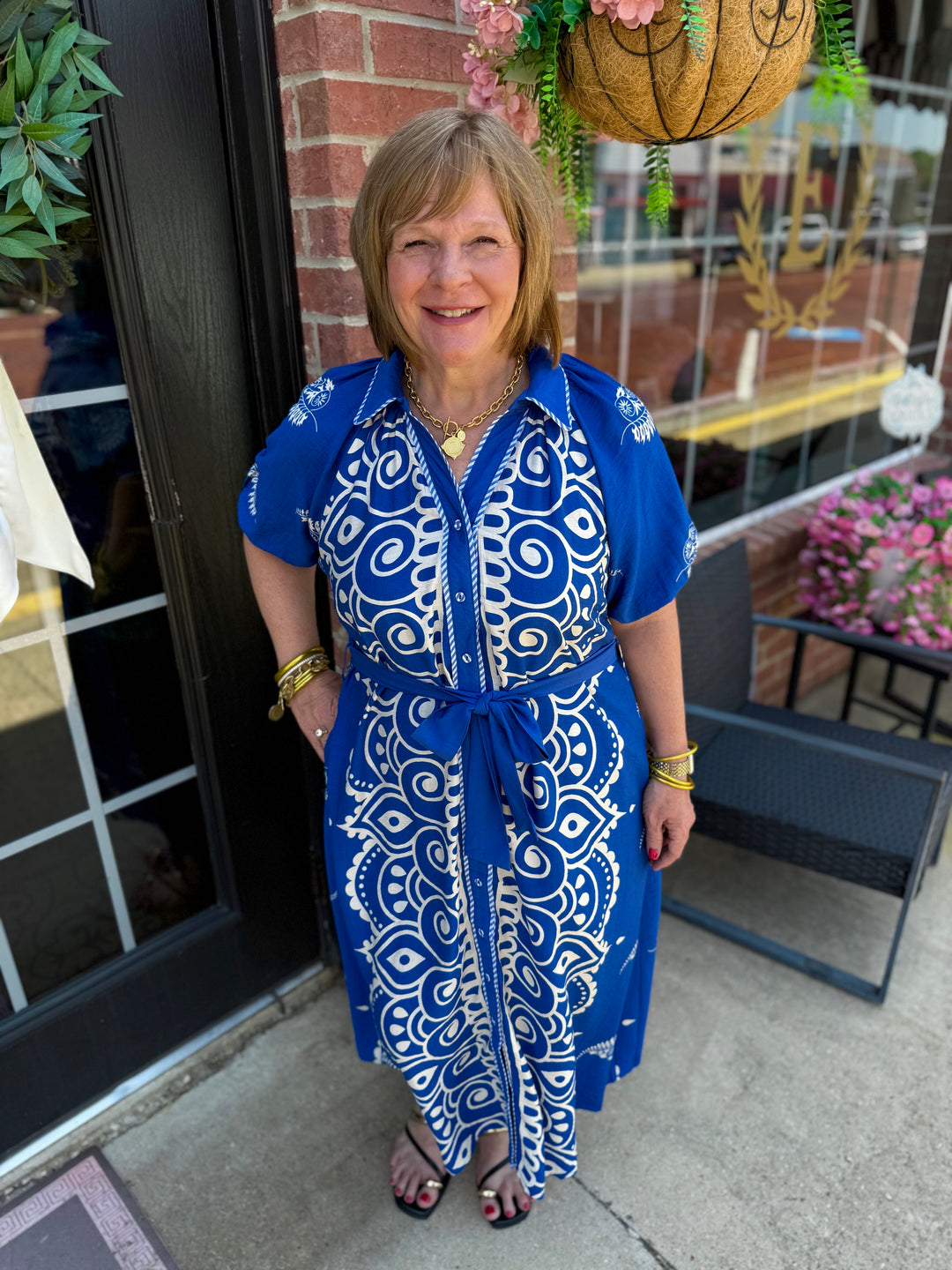 Savannah Paisley Midi Dress in blue and white pattern with adjustable waist tie, available in sizes XS-XL.