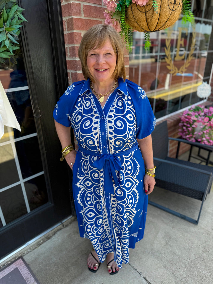 Savannah Paisley Midi Dress in blue and white pattern with adjustable waist tie, available in sizes XS-XL.