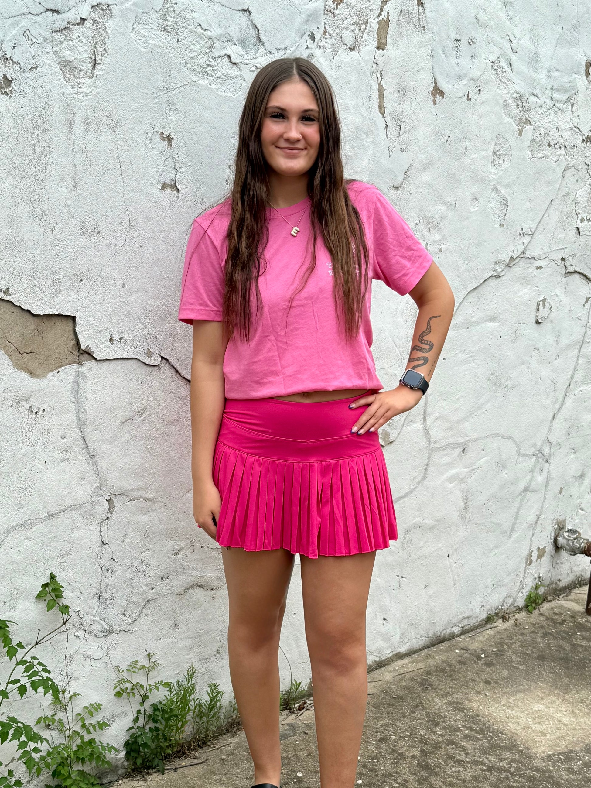Play It Bold Pleated Active Skort in hot pink, ideal for summer, available in sizes XS-XL.