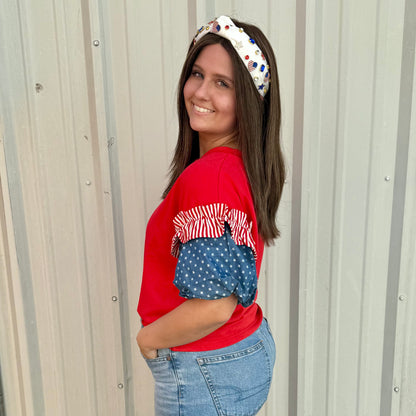 Liberty Ruffle Accent Puff Sleeve Top: red body, blue and white star sleeves. Available in sizes S-XL.