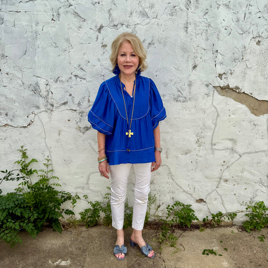 Blue Belle Lace Trim Blouse with lace accents. Available in sizes XS–XL.