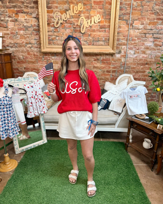 Red USA Pop Up Letter Sweater Knit Top. Available in sizes S-XL.