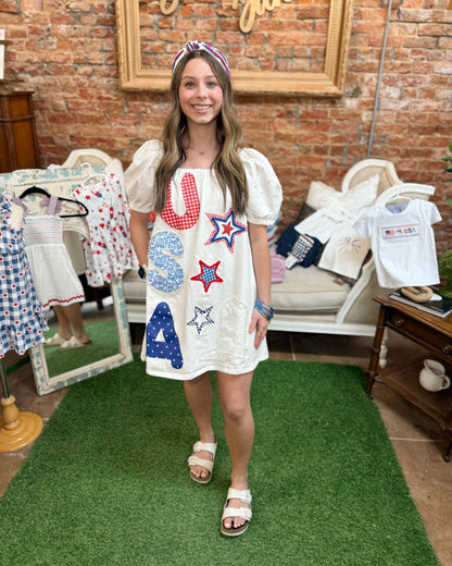 Star-Spangled Sweetheart Denim Dress; available in sizes XS-XL. Blue denim with star pattern and sweetheart neckline.