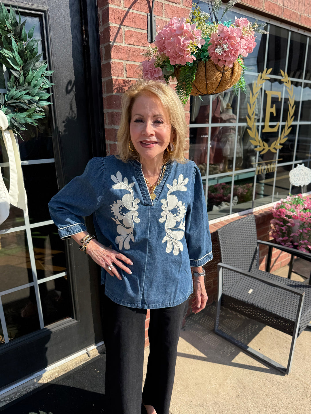 Ellie Washed Denim Floral Top with 3/4 sleeves, available in sizes XS-XL.