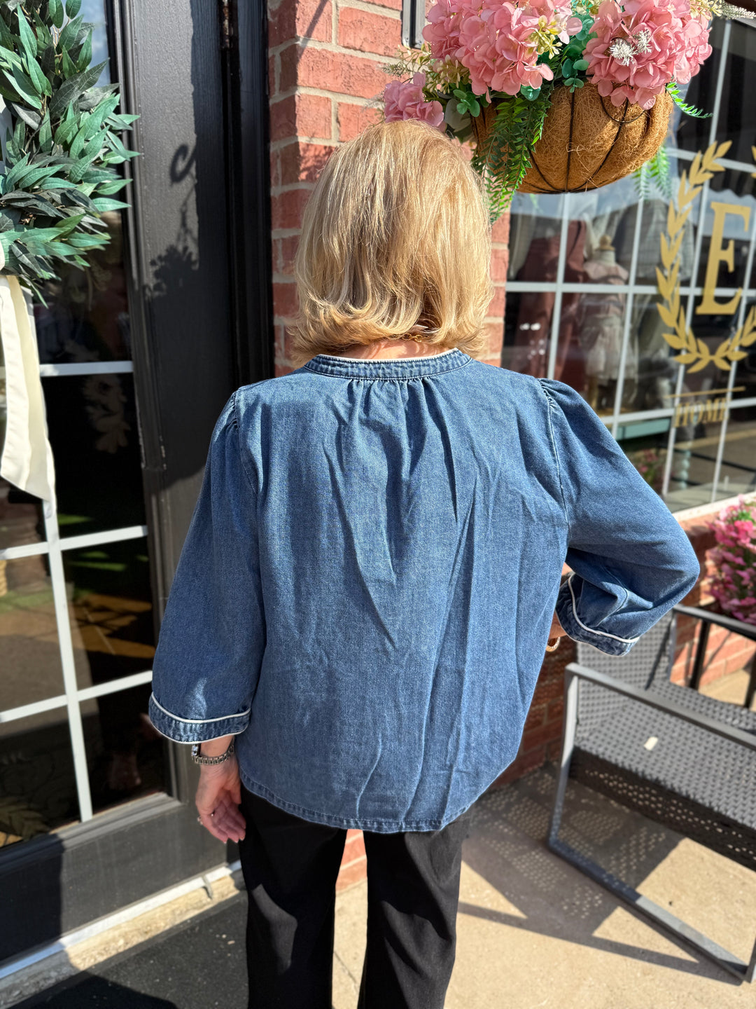 Ellie Washed Denim Floral Top with 3/4 sleeves; available in sizes XS-XL.