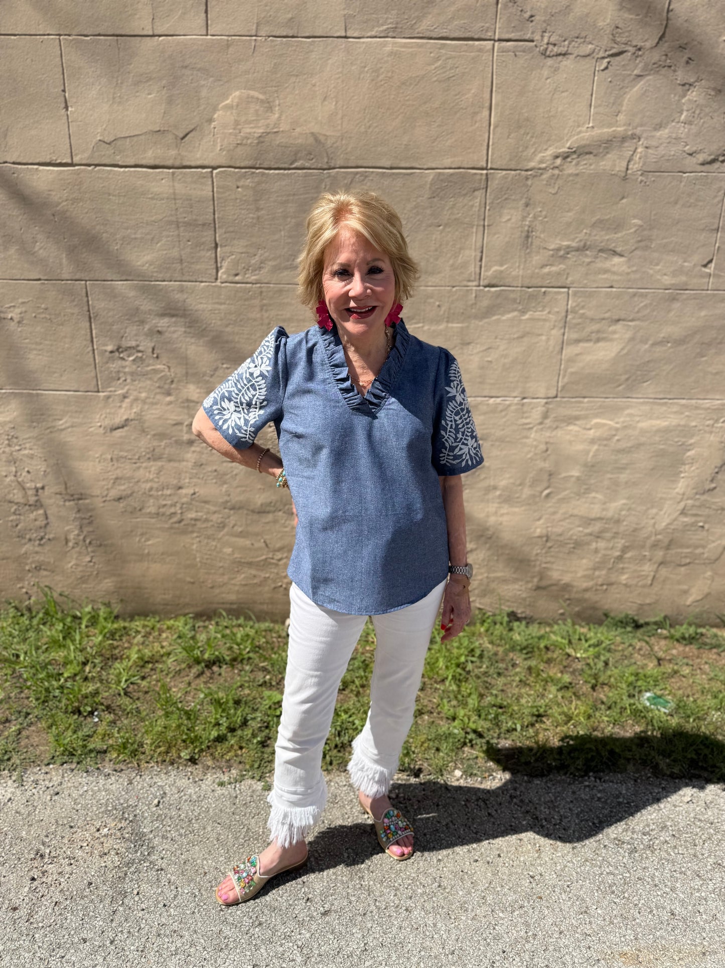 Denim Floral Top with patterned sleeves; available in sizes XS–XL.