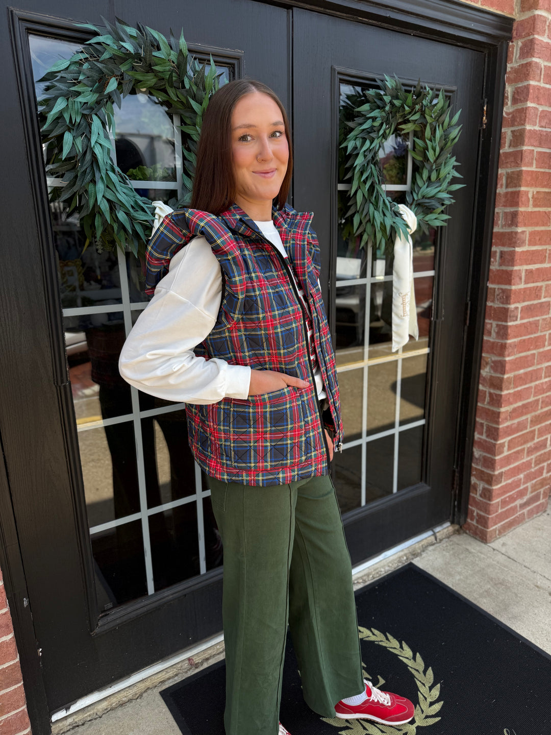 Plaid Tidings Puffer in festive plaid; available in sizes XS–XXL.
