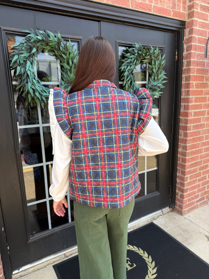 Plaid Tidings Puffer, available in sizes XS–XL.