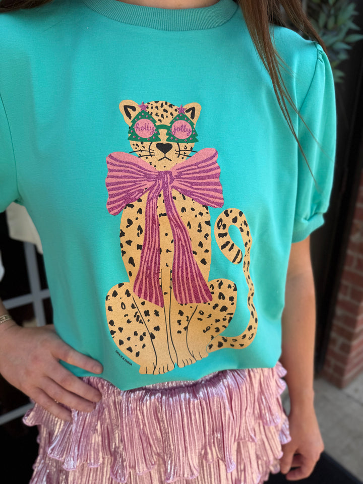 Teal mint Cheetah Puff Sleeve Tee featuring a glitter cheetah print graphic with festive glasses and a large pink bow. Available in multiple sizes.
