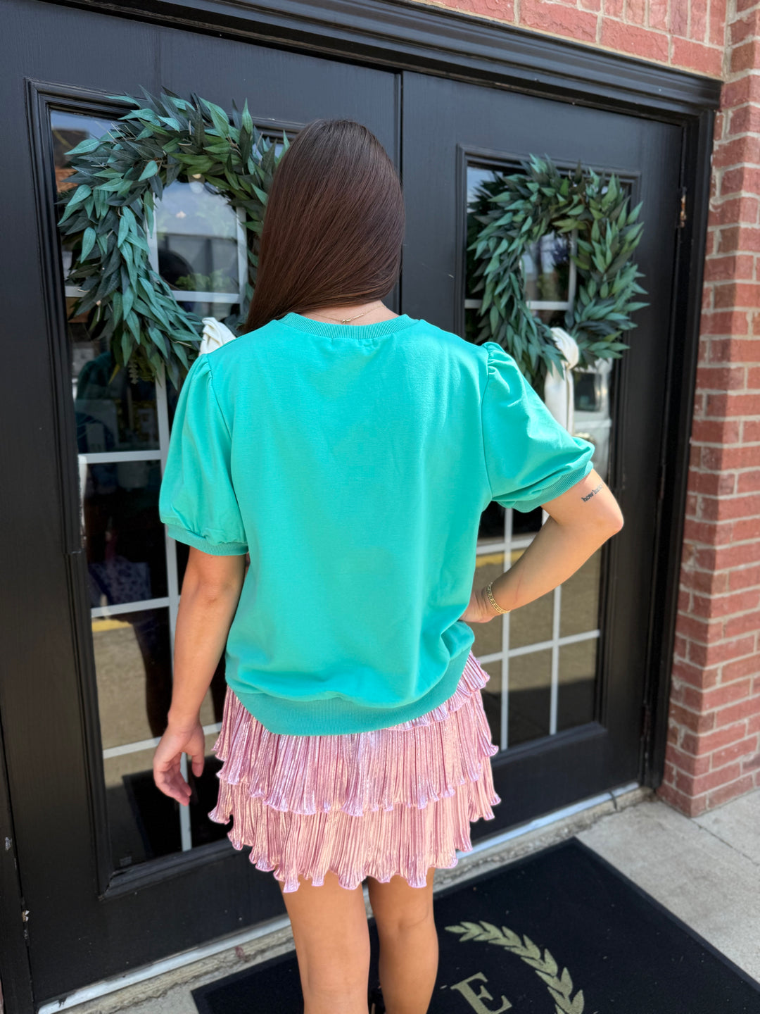 Teal Cheetah Puff Sleeve Tee with relaxed fit, puff shoulders, crew neckline, and glitter cheetah print. Available in multiple sizes.