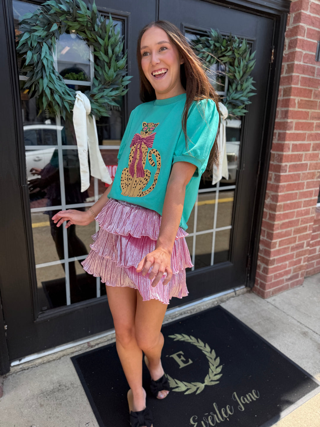 Teal Cheetah Puff Sleeve Tee featuring a glitter cheetah print with a bow. Available in all sizes.