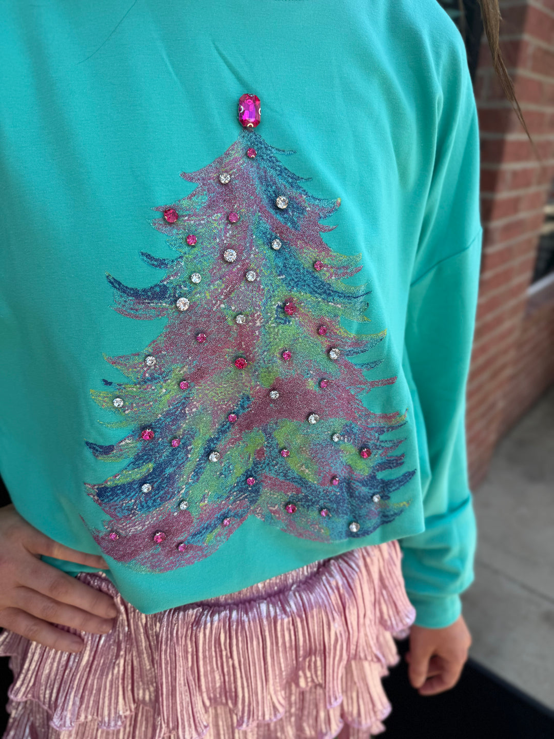 Teal Gemstone Christmas Tree sweatshirt with glittery, multicolored graphic and pink and clear rhinestones. Available in all sizes.