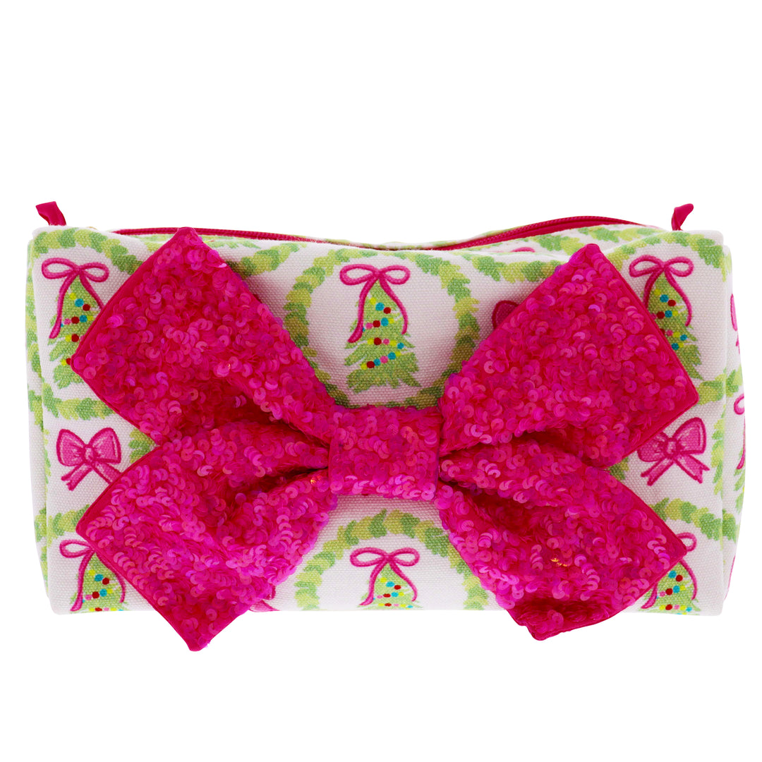 White zip pouch with green wreaths, pink bows, and a large sparkly hot pink bow on the front. Available in multiple sizes.