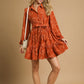 Piper Jacquard Dress with tie waist and long sleeves. Available in sizes XS-XL.