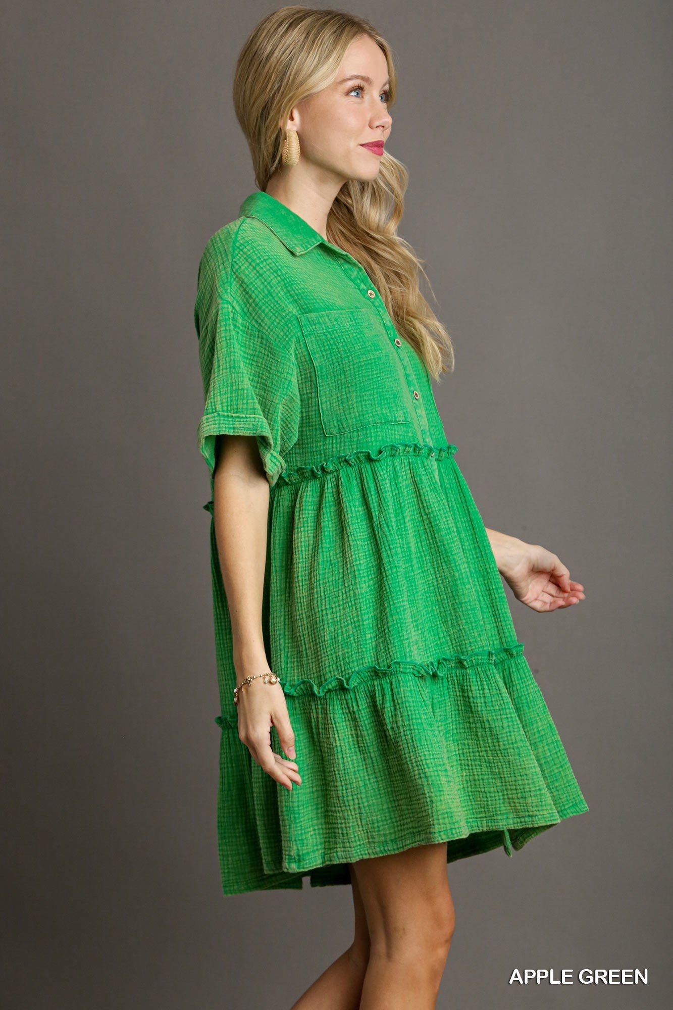 The Mineral Wash Button Down Dress includes stylish fray details and two functional chest pockets, perfect for a polished casual look. The dress is available in multiple sizes.