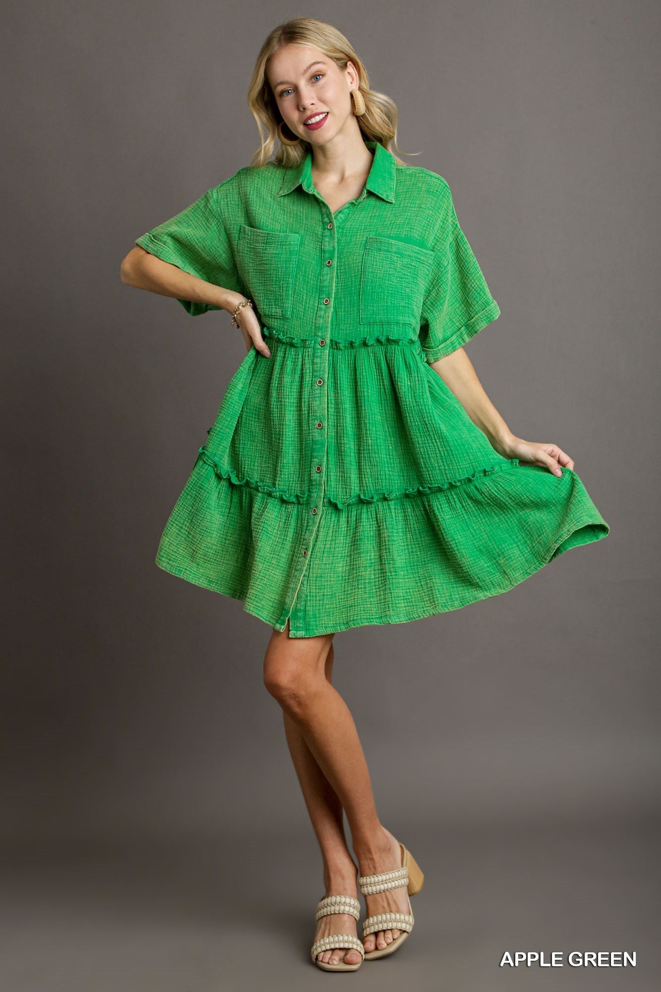 Product: Mineral Wash Button Down Dress with Fray Details & Chest Pockets. This dress is made of vibrant apple green cotton gauze and features short sleeves, a button-up front, and fray details. Available sizes for this dress may vary.