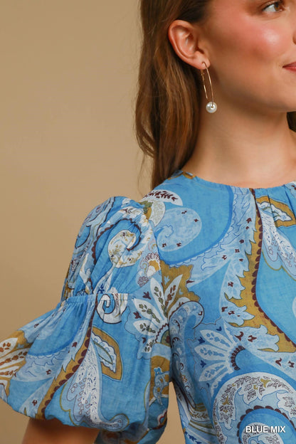 Paisley Blue Mix Babydoll Dress with puffed sleeves and paisley print. Available in sizes XS–XL.