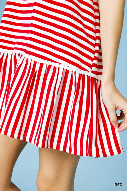 The Lacey Ruffle Dress features red and white vertical stripes with a tiered hemline. Available sizes: XS, S, M, L, XL.