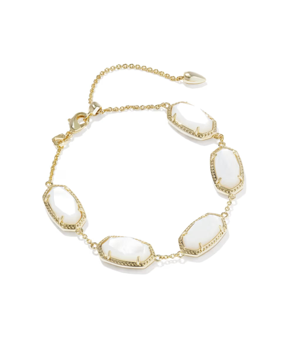 Elaina Gold Link Bracelet in Ivory Mother of Pearl by Kendra Scott with five oval ivory mother-of-pearl stones bordered in gold on a gold link chain, adjustable clasp, available in one size.