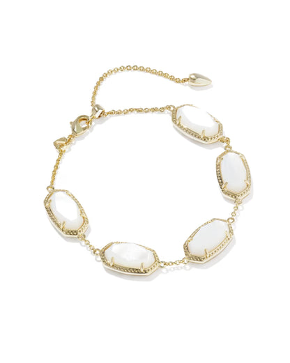 Elaina Gold Link Bracelet in Ivory Mother of Pearl by Kendra Scott with five oval ivory mother-of-pearl stones bordered in gold on a gold link chain, adjustable clasp, available in one size.