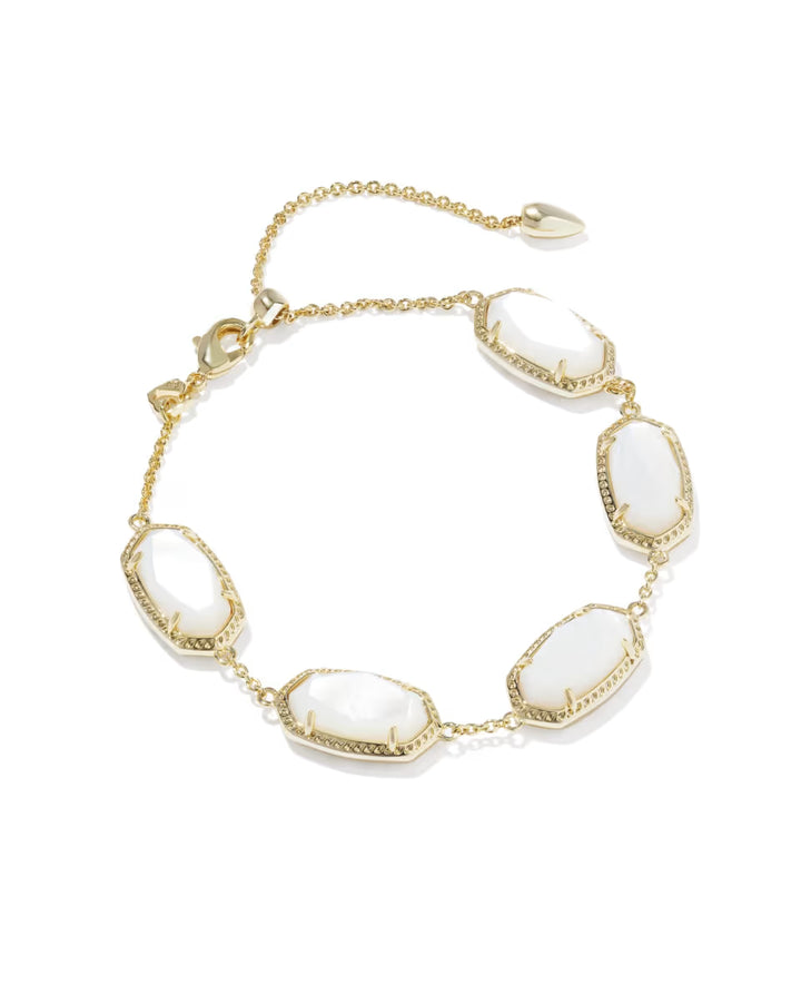 Elaina Gold Link Bracelet in Ivory Mother of Pearl by Kendra Scott with five oval ivory mother-of-pearl stones bordered in gold on a gold link chain, adjustable clasp, available in one size.