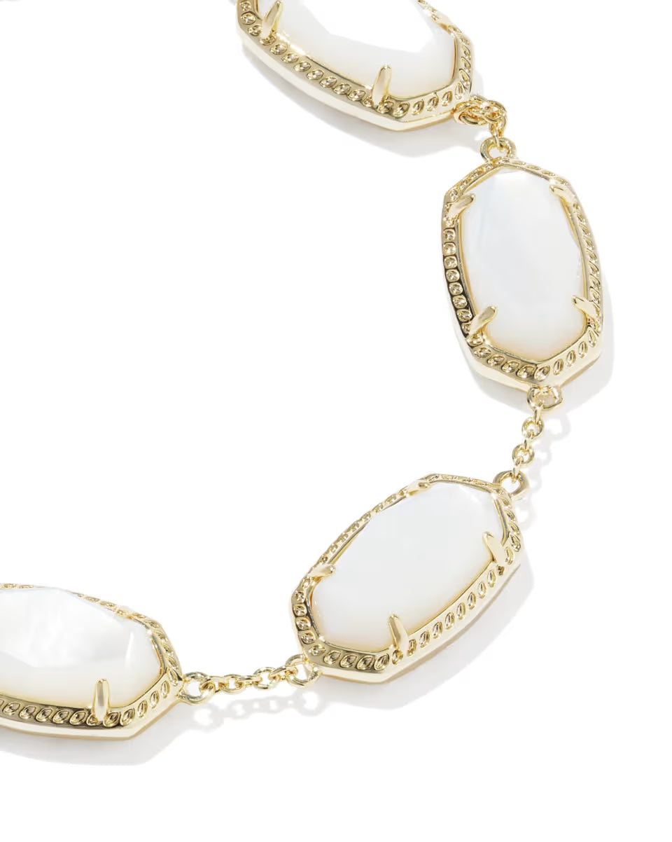 Elaina Gold Link Bracelet in Ivory Mother of Pearl by Kendra Scott, with large oval ivory mother-of-pearl stones in gold frames and small gold links. Available sizes: 6.5″, 7″, and 7.5″.