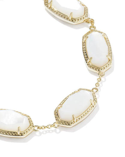 Elaina Gold Link Bracelet in Ivory Mother of Pearl by Kendra Scott, with large oval ivory mother-of-pearl stones in gold frames and small gold links. Available sizes: 6.5″, 7″, and 7.5″.