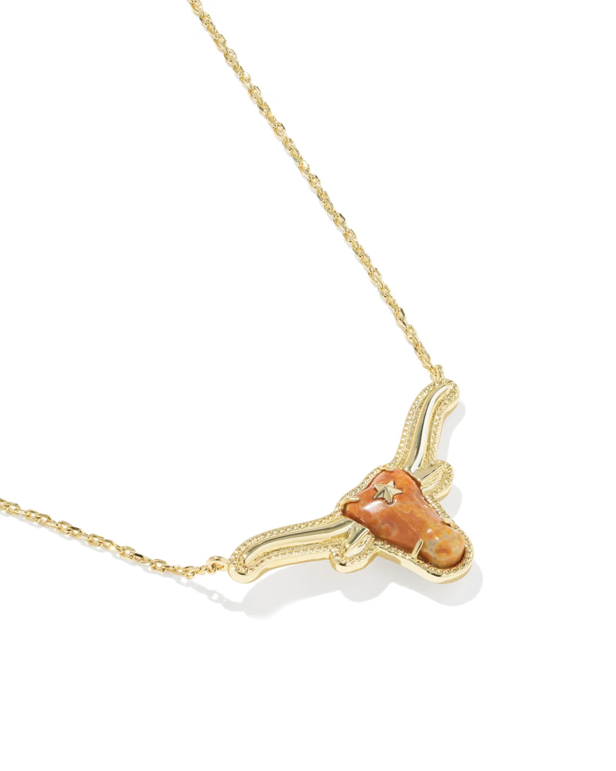 The Longhorn Gold Short Pendant Necklace by Kendra Scott features a 14k gold longhorn steer head pendant with a mottled orange and tan center stone on a delicate short chain. Available in standard necklace lengths.