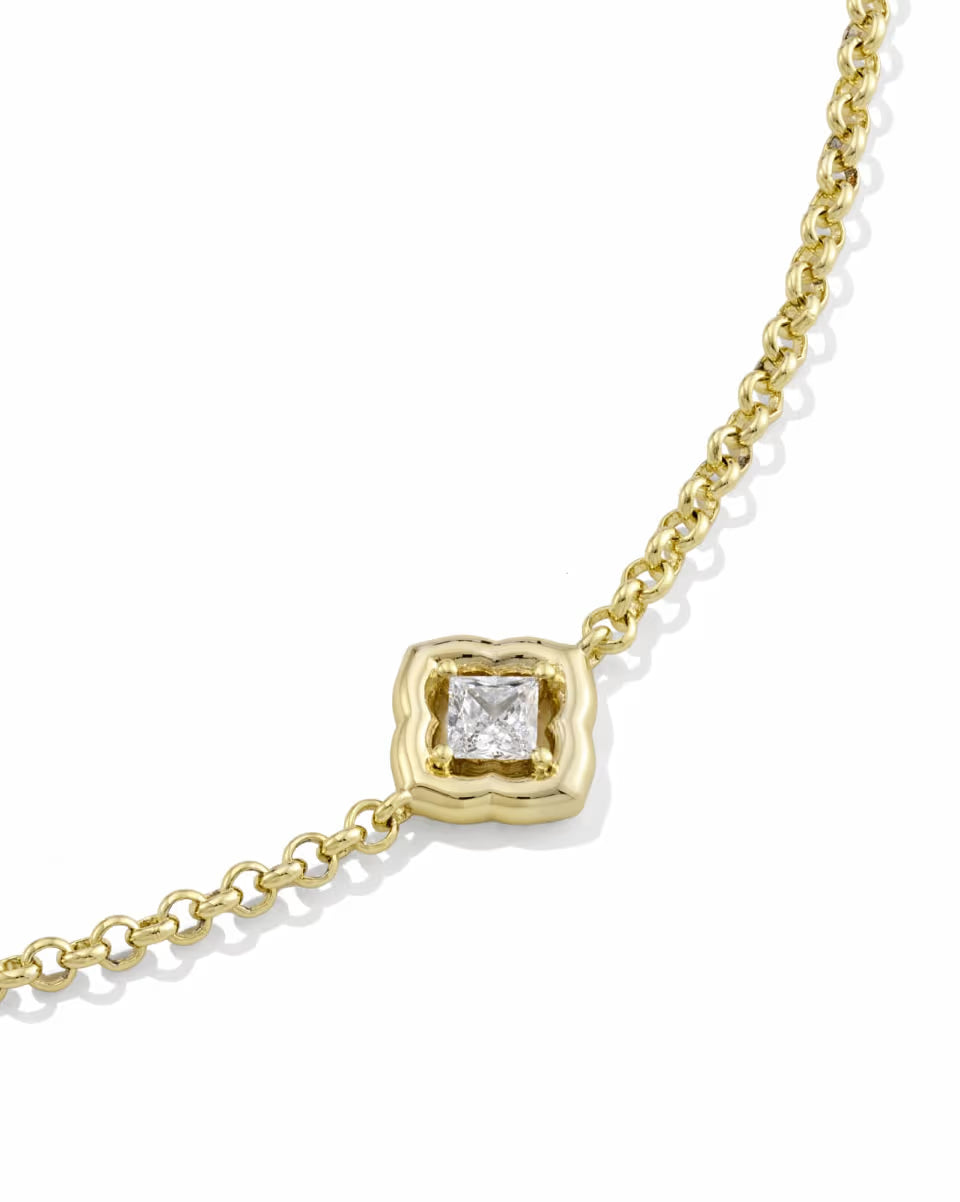 Gold chain necklace with square-shaped diamond in decorative bezel. Available sizes: 16″, 18″.