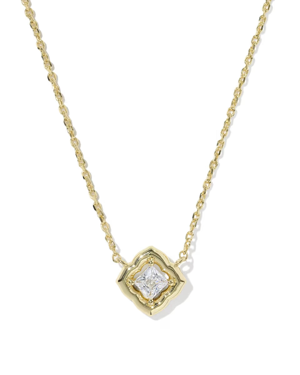 Square gold pendant necklace with central white CZ stone in a decorative frame. Simple, delicate design. Available in short lengths.