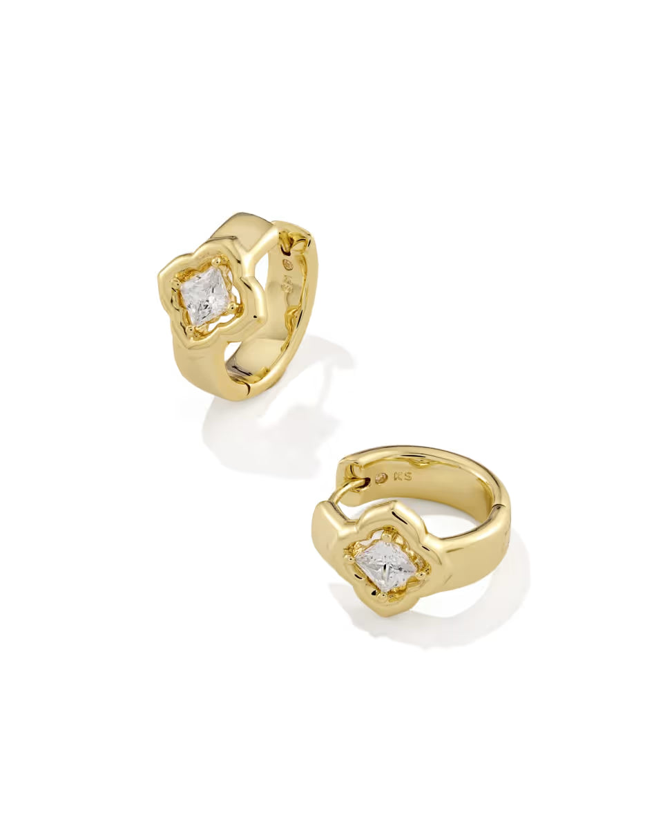 The Mallory Crystal Gold Huggie Earrings by Kendra Scott feature gold hoops with square-cut white CZs in wavy gold frames. Sizes available.