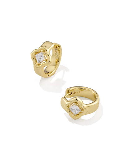 The Mallory Crystal Gold Huggie Earrings by Kendra Scott feature gold hoops with square-cut white CZs in wavy gold frames. Sizes available.