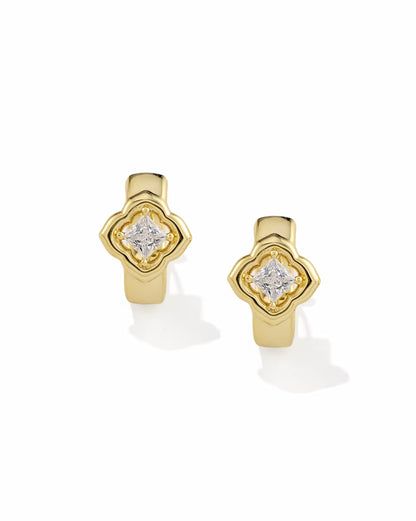 Gold huggie earrings with square white CZ gemstone in a clover-inspired setting at the center, available in multiple sizes.