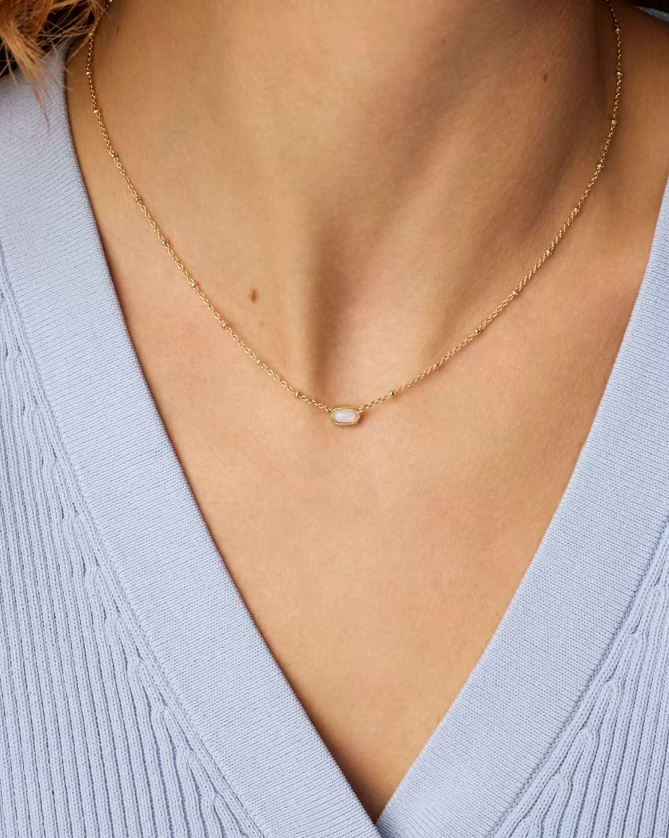 Mini Elisa Gold Satellite Short Pendant Necklace in Pink Opalite Crystal by Kendra Scott, available in 15-17 inch lengths.