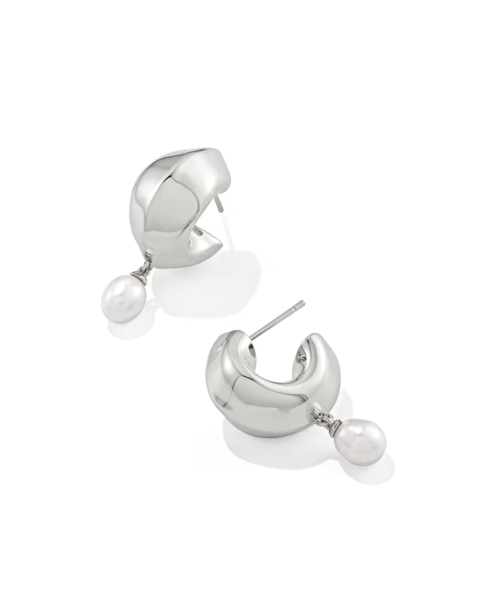Oakland Pearl Silver Huggie Earrings from Kendra Scott: polished silver hoops with a single dangling freshwater pearl; available in one size.