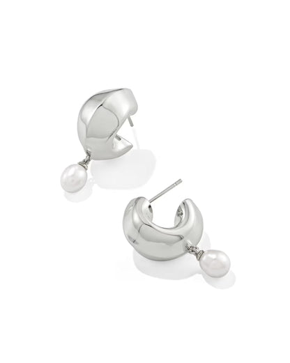 Oakland Pearl Silver Huggie Earrings from Kendra Scott: polished silver hoops with a single dangling freshwater pearl; available in one size.