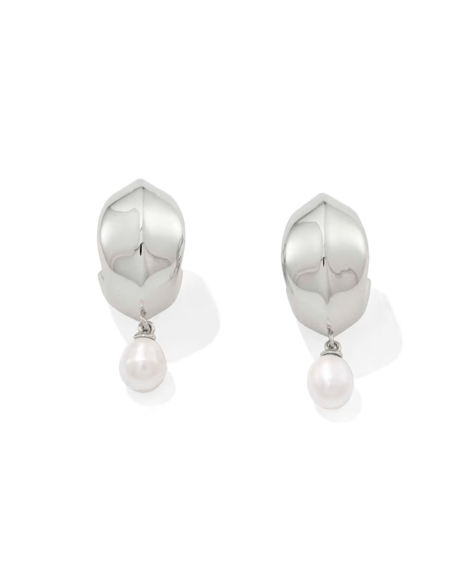 Oakland Pearl Silver Huggie Earrings by Kendra Scott: polished silver huggies with rounded tops and a single white freshwater pearl drop. Available in one size.