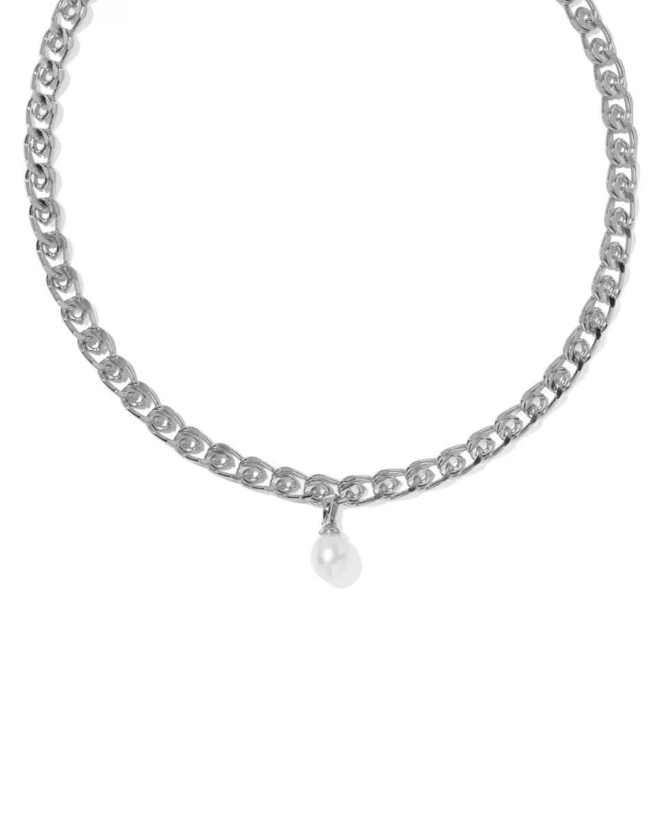 The Oakland Pearl Silver Chain Necklace by Kendra Scott has thick, oval-shaped silver links and a small freshwater cultured pearl pendant at the center. Available sizes: 16″, 18″, and 20″.