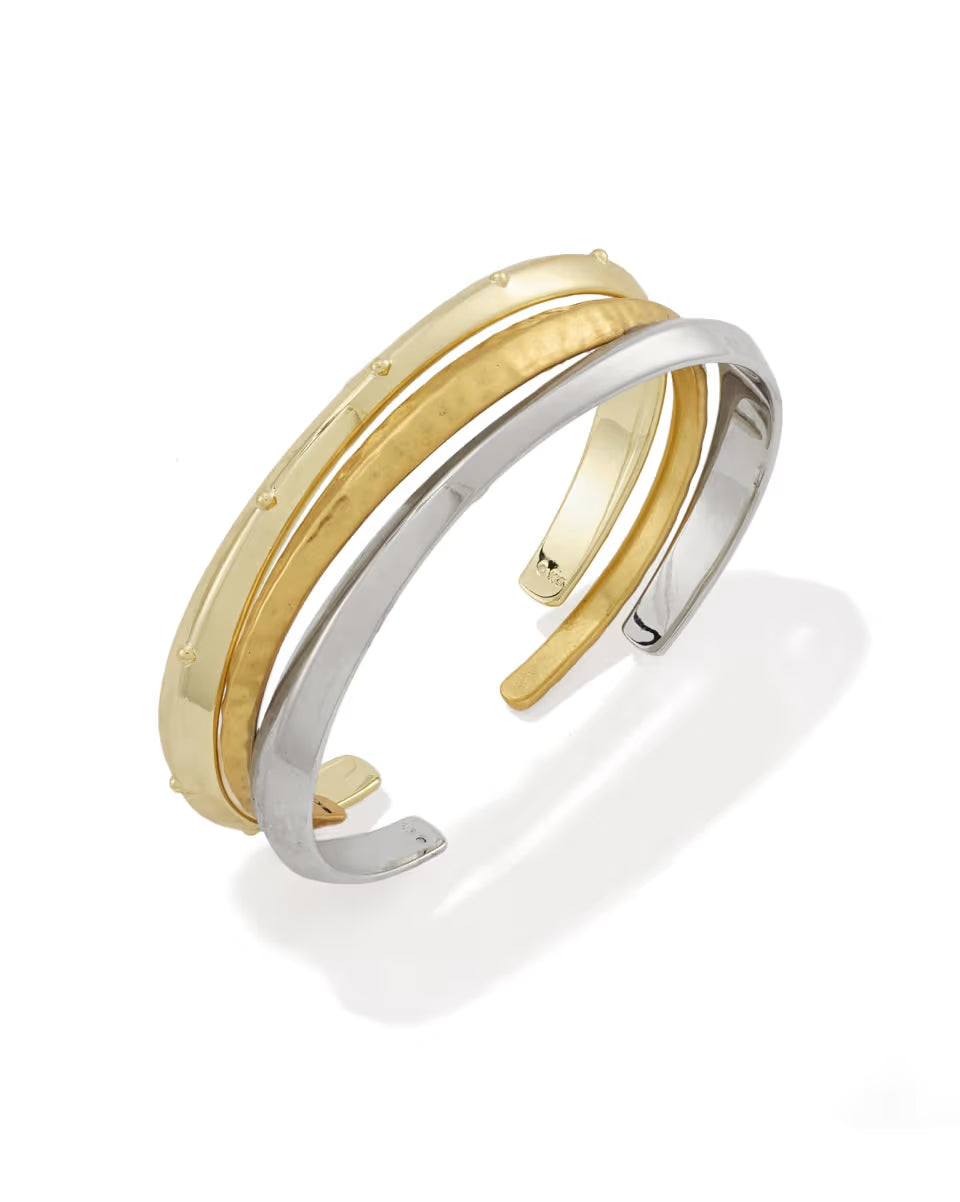 The Oakland Mixed Metal Set of 3 Cuff Bracelets features intertwined gold and silver bands, with delicate raised dots on the gold band. Available in S/M and M/L.