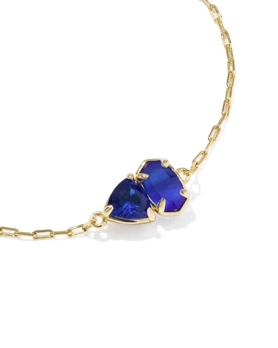 Tatum Gold Delicate Chain Bracelet in Cobalt Mix by Kendra Scott features two uniquely shaped deep blue stones set in gold, available in multiple sizes.