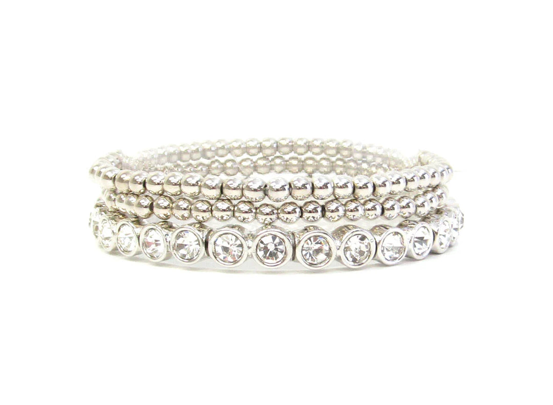 Three silver beaded stretch bracelets with clear round gemstones on one strand; available in multiple sizes.