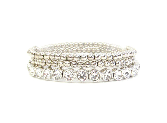 Three silver beaded stretch bracelets with clear round gemstones on one strand; available in multiple sizes.